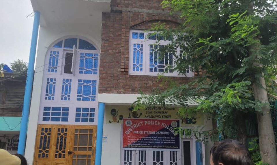 District Police Kulgam attaches Two storied Residential house/commercial property worth appropriate market value of Rs 3 Crores of a notorious drug peddler on national highway in Qazigund, Kulgam