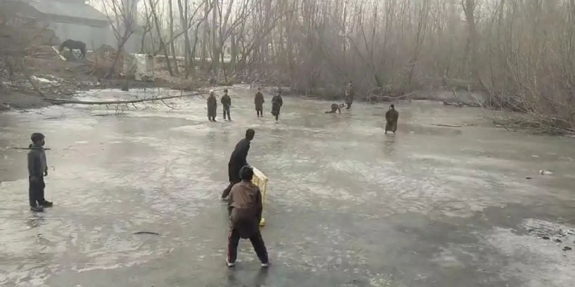 Children turn frozen pond into Cricket pitch in Sopore