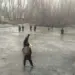 Children turn frozen pond into Cricket pitch in Sopore